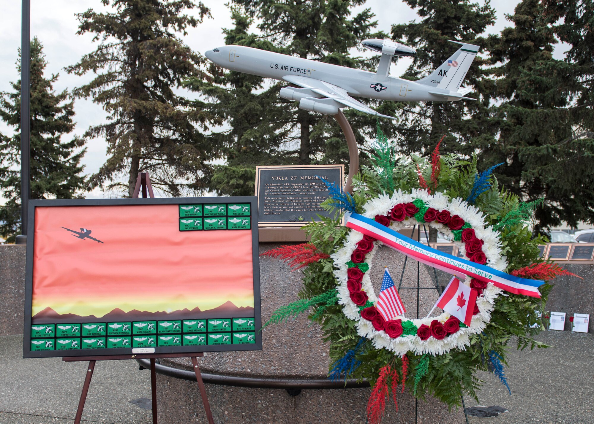 Surviving family members, distinguished guests and members of 962nd Airborne Air Control Squadron attend the Yukla 27 25th anniversary memorial ceremony at Joint Base Elmendorf-Richardson, Alaska, Sept. 22, 2020. Yukla 27, a U.S. Air Force E-3 Sentry airborne warning and control system aircraft assigned to the 962nd AACS, encountered a flock of geese Sept. 22, 1995, and crashed shortly after takeoff on a routine surveillance training sortie, killing all 24 Canadian and U.S. Airmen aboard.