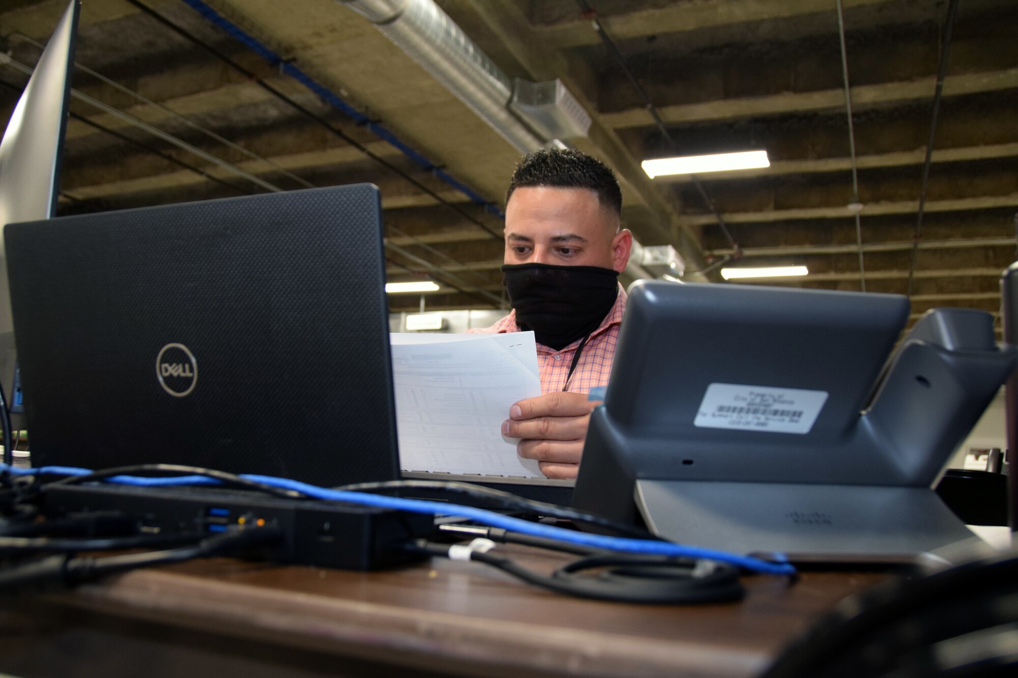 Tech. Sgt. Juan Vazquez Garcia, 433rd Medical Group, processes a COVID-19 positive case report as a case investigator at the Bexar County COVID-19 Operations center in San Antonio, Texas Sept. 17, 2020.