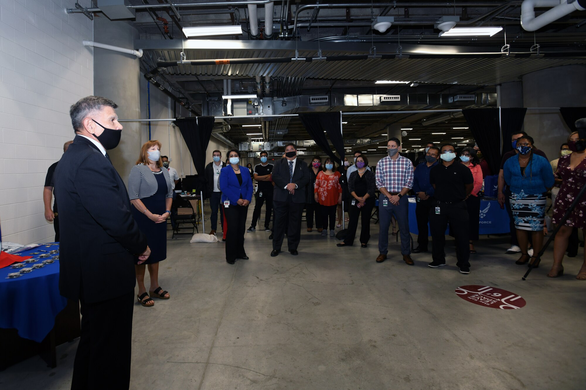 Retired Maj. Gen. Juan Ayala, City of San Antonio director of military affairs, and Kimberly Toney, Air Force Personnel Center executive director, speak during a recognition ceremony for 433rd Airlift Wing Reserve Citizen Airmen who assisted the Bexar County COVID-19 operations center Sept. 17, 2020 in San Antonio, Texas.