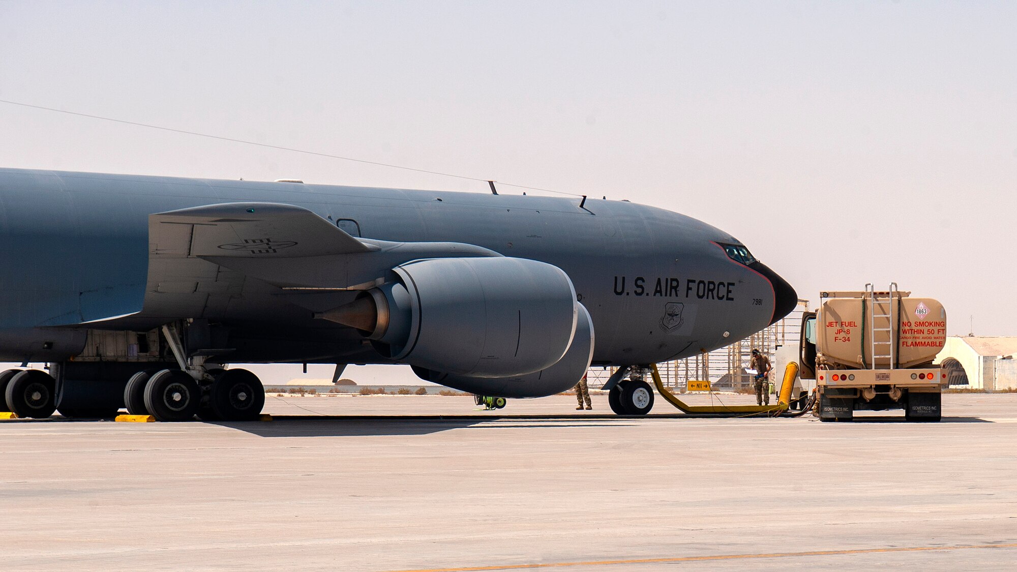 A U.S. Air Force KC-135 Stratotanker aircraft assigned to the 379th Air Expeditionary Wing is refueled during a hot refueling training scenario at Al Udeid Air Base, Qatar, Sept. 21, 2020. Personnel from the 379th Expeditionary Aircraft Maintenance Squadron, 379th Expeditionary Logistics Readiness Squadron and 340th Expeditionary Air Refueling Squadron attended the training. The certification they receive will enable personnel to refuel a KC-135 while one or more engines run.