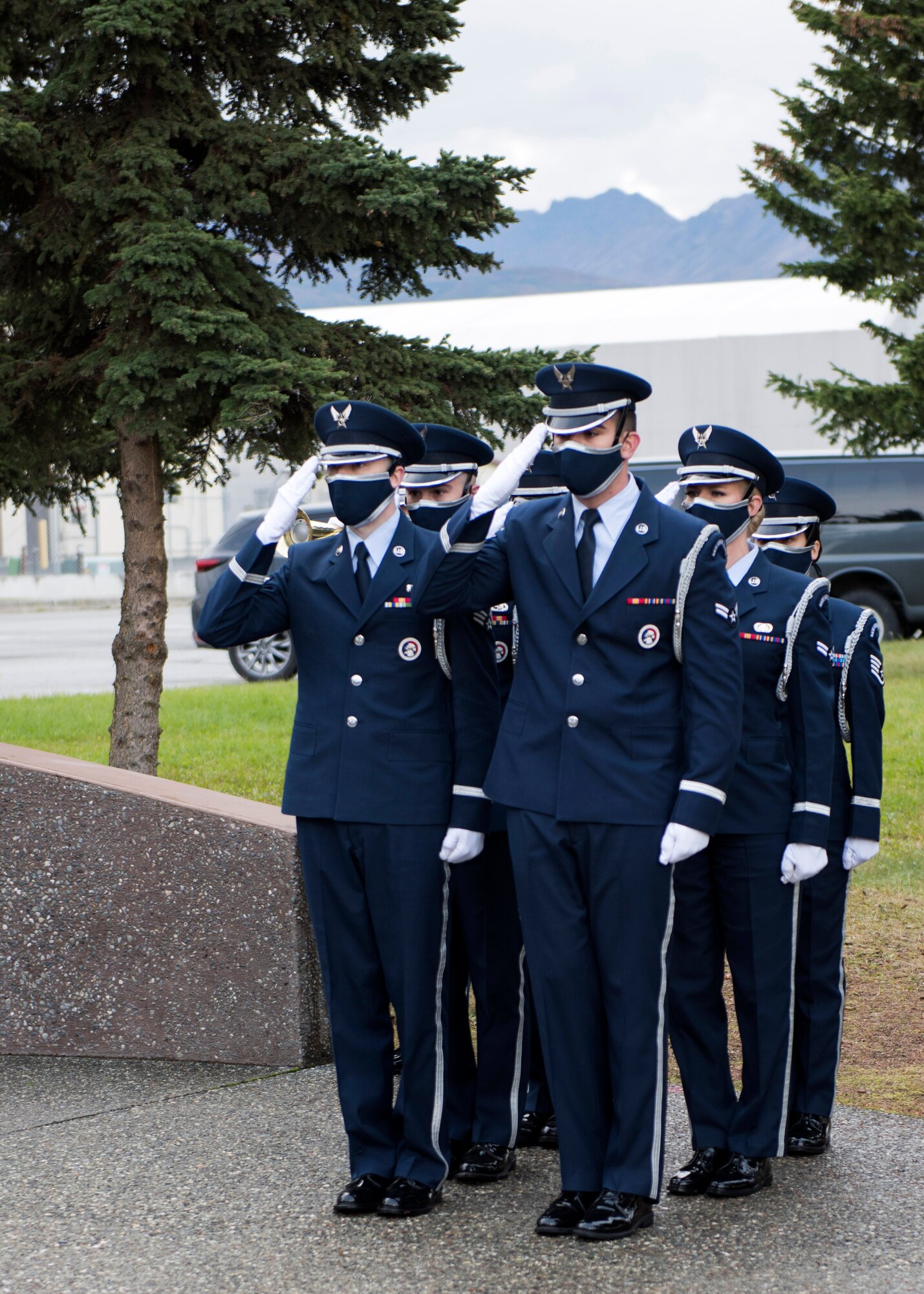 The U.S. Air Force Honor Guard renders a salute at the Yukla 27 25th anniversary memorial ceremony at Joint Base Elmendorf-Richardson, Alaska, Sept. 22, 2020. Yukla 27, a U.S. Air Force E-3 Sentry airborne warning and control system aircraft assigned to the 962nd AACS, encountered a flock of geese Sept. 22, 1995, and crashed shortly after takeoff on a routine surveillance training sortie, killing all 24 Canadian and U.S. Airmen aboard.
