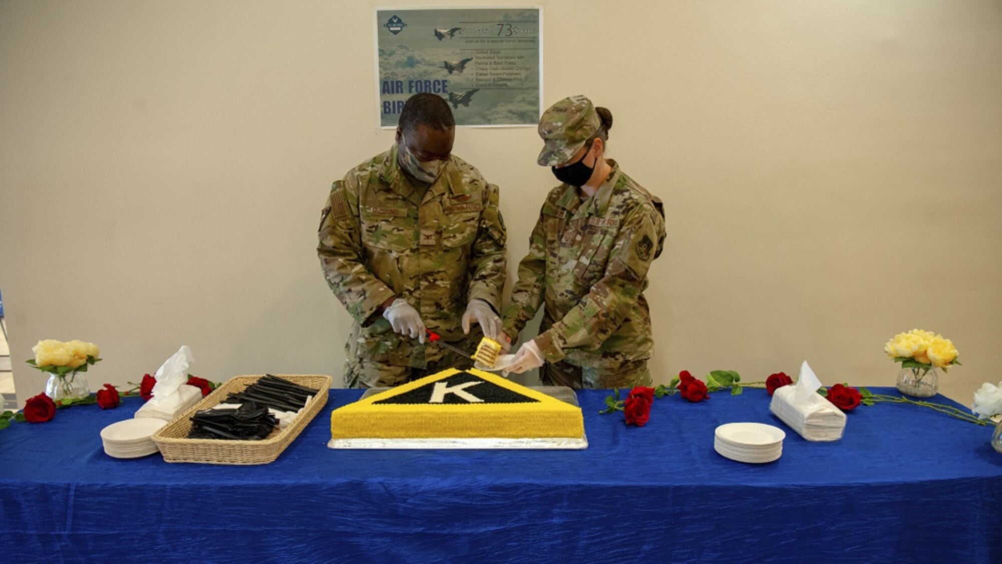 U.S. Air Force Col. Miles McClung, the 379th Air Expeditionary Wing vice commander, cuts into a special-made Triangle K cake, a nod the Wing's heritage, on Sept. 18, 2020, at Al Udeid Air Base, Qatar. AUAB personnel enjoyed a wide variety of COVID-compliant activities to help them connect and celebrate the Air Force's 73rd birthday. (U.S. Air Force photo by Staff Sgt. Heather Fejerang)