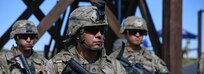 U.S. Staff Sgt. Juan Sanchez, 18th Military Police Brigade, takes directions from the range safety during the M4 Carbine zeroing range portion of the U.S. Army Europe European Best Warrior Competition at U.S. Army Garrison Hohenfels Training Area, Germany, July 27, 2020. The competition is an annual event with competitors assigned to United States Army Europe and United States Army Africa. Officers, noncommissioned officers and junior enlisted Soldiers compete in separate categories and are evaluated on general military knowledge, physical fitness and common military tasks. Winners in the NCO and junior enlisted categories will advance to represent U.S. Army Europe at the Army Best Warrior Competition at Fort Lee, Virginia. For more information about the competition, visit https://www.eur.army.mil/EBWC/. (U.S. Army photo by Spc. Denice Lopez)