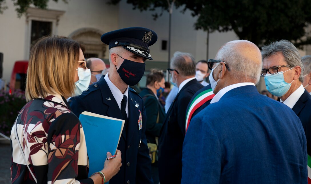 U.S. Brig. Gen. Jason Bailey, 31st Fighter Wing commander, speaks with Sergio De Pellgrin, a former honorary squadron commander of the 31st Maintenance Squadron, at the 19th Annual Italian-American Friendship Festival, Aviano, Italy, Sept. 12, 2020. The Honorary Squadron Commanders Association is in charge of organizing the festival. Exemplary members of the community are chosen as honorary squadron commanders. (U.S. Air Force photo by Senior Airman Caleb House)