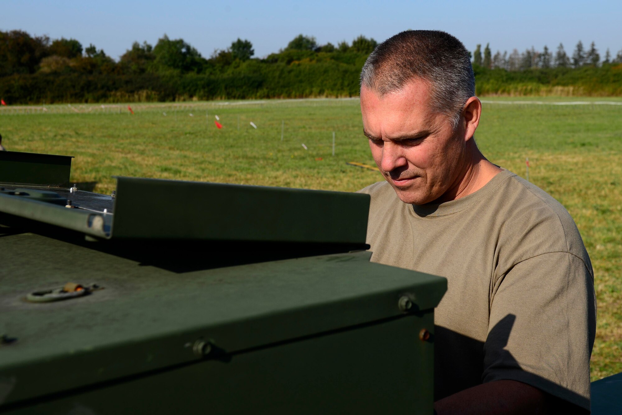 U.S. Air National Guard Master Sgt. Jared Hass, 116th Air Control Squadron heating, ventilation, and air conditioning noncommissioned officer in charge, checks a generator during exercise Astral Knight 20 at Malbork Air Base, Poland, Sept. 23, 2020. Members of both the 116th and 128th ACS augmented the 606th ACS during AK20. (U.S. Air Force photo by Tech. Sgt. Tory Cusimano)