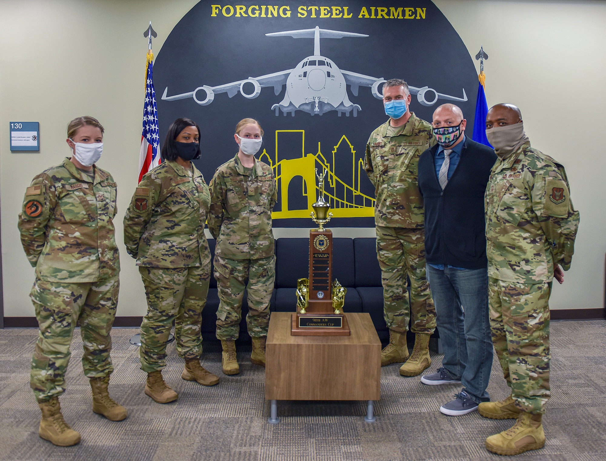 Chief Master Sgt. Jamesha Barnes, command chief of the 911th Airlift Wing, poses for a photo with members of the 911th Logistics Readiness Squadron at the Pittsburgh International Airport Air Reserve Station, Pennsylvania, Sept. 16, 2020.