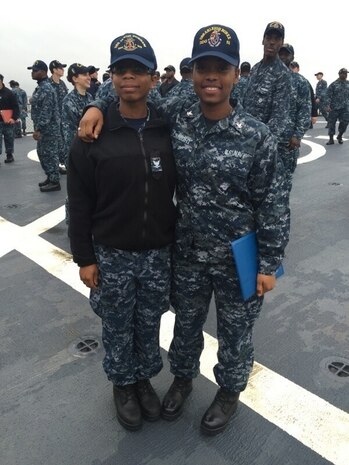 Quartermaster 3rd Class Malaysia McKnight and Fire Controlman 3rd Class Qunisha Lytch pose for a photo.