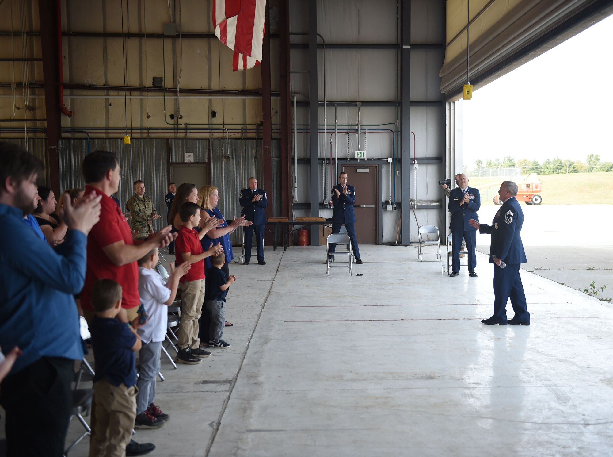 Friends and family applaud Chief Master Sgt. Timothy Whisler, 132d Fire and Emergency Services chief, during his retirement ceremony September 19, 2020 at the 132d Wing in Des Moines, Iowa. Whisler served as a firefighter for 41 years. (U.S. Air National Guard photo by Senior Master Sgt. Robert Shepherd)