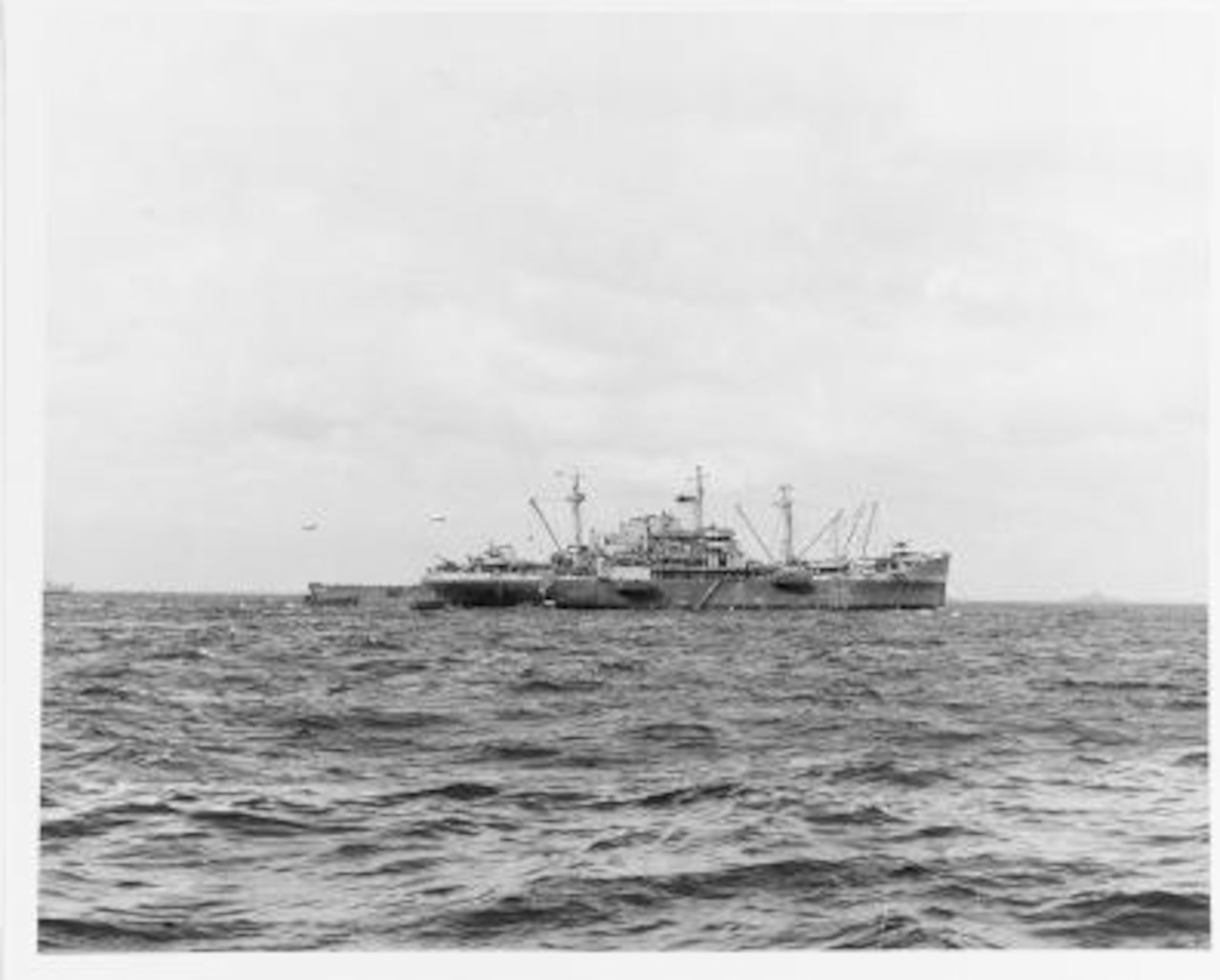 A photo shows a ship sailing in the distance.