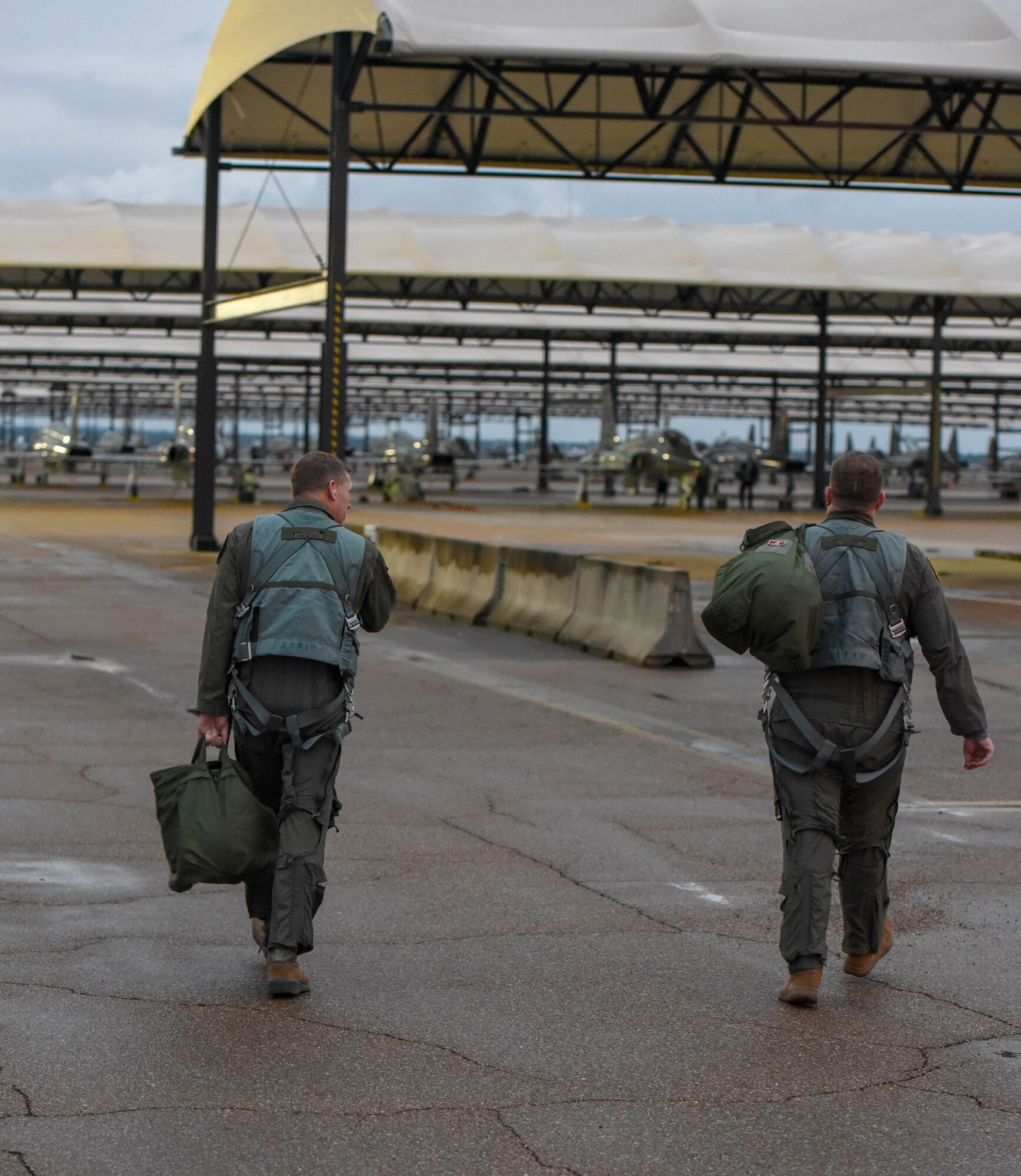 U.S. Air Force Lt. Col. David Easterling Jr. (left), 43rd Flying Training Squadron instructor pilot, and Capt. Kevin Mudd (right), 50th FTS instructor pilot, walk towards a T-38 Talon on September 23, 2020 at Columbus Air Force Base, Miss. The T-38 is a twin-engine, high-altitude, supersonic jet trainer used in a variety of roles because of its design, economy of operations, ease of maintenance, high performance and exceptional safety record. (U.S. Air Force photo by Airman 1st Class Davis Donaldson)