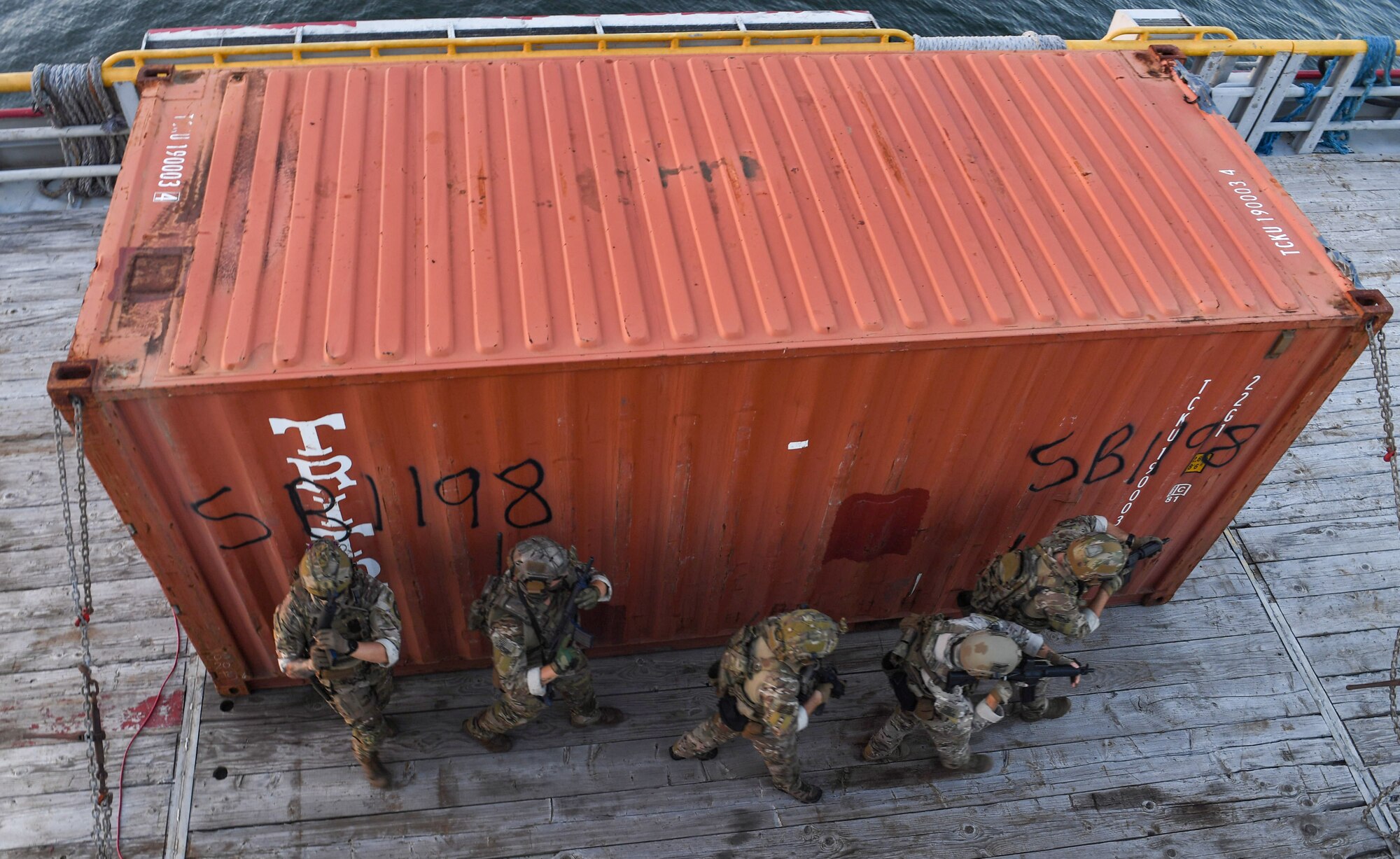 U.S. Coast Guardsmen from the Maritime Security Response Team East simulate interdicting a jammer on a vessel in support of Advanced Battle Management System Onramp 2 in the Gulf of Mexico, Sept. 2, 2020. ABMS is an interconnected battle network - the digital architecture or foundation - which collects, processes and shares data relevant to warfighters. In order to achieve all-domain superiority, it requires that individual military activities not simply be de-conflicted, but rather integrated – activities in one domain must enhance the effectiveness of those in another domain. (U.S. Air Force photo by Staff Sgt. Haley Phillips)