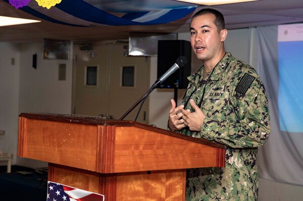 Lt. Victor Gutierrez, administrative officer of the Wasp-class amphibious assault ship USS Kearsarge (LHD 3) speaks during a Hispanic heritage event aboard Kearsarge.