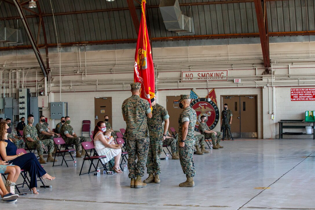 Lt. Col Robert G. Reinoehl assumes command of Headquarters and Headquarters Squadron (H&HS) during a change of command ceremony at the search and rescue (SAR) hanger aboard Marine Corps Air Station (MCAS) Yuma on July 21, 2020.