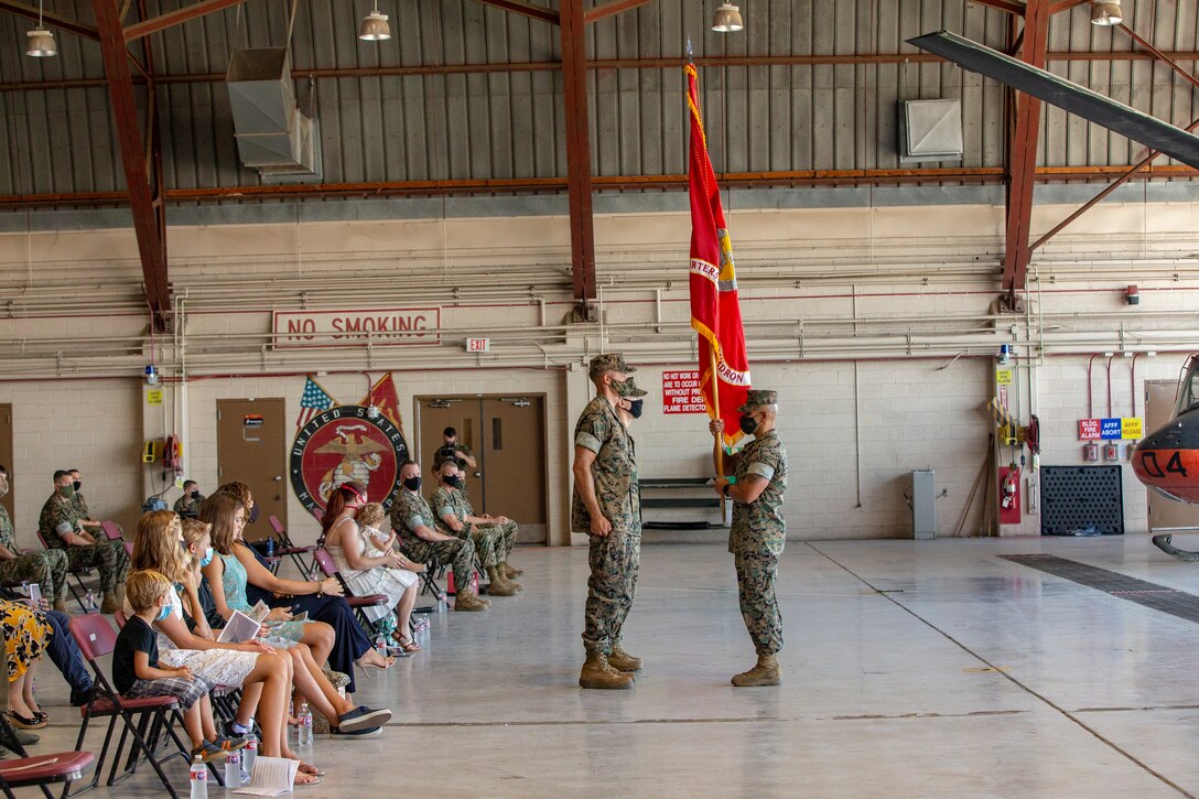 Lt. Col Robert G. Reinoehl assumes command of Headquarters and Headquarters Squadron (H&HS) during a change of command ceremony at the search and rescue (SAR) hanger aboard Marine Corps Air Station (MCAS) Yuma on July 21, 2020.