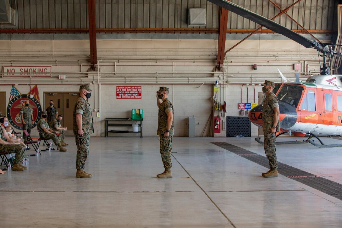 Lt. Col Robert G. Reinoehl assumes command of Headquarters and Headquarters Squadron (H&HS) during a change of command ceremony at the search and rescue (SAR) hanger aboard Marine Corps Air Station (MCAS) Yuma on July 21, 2020.