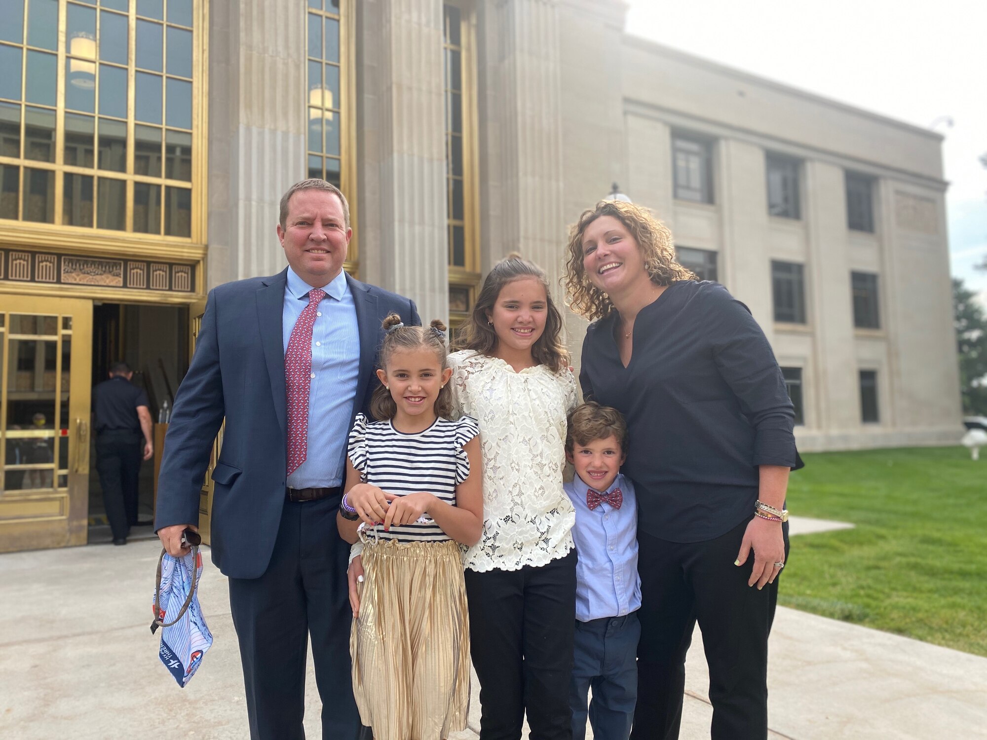 Maj. Robert Sanford, who serves part time as the 419th Security Forces Squadron commander at Hill Air Force Base, Utah, poses with his family at his robing ceremony, where he was appointed as a circuit court judge in Laramie, Wyoming