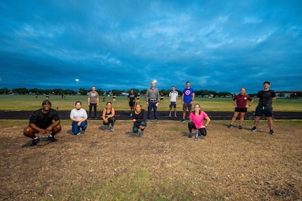 U.S. Air Force Chief Master Sgt. Wendell Snider (left), 502nd Air Base Wing and Joint Base San Antonio command chief, pose for a photo with participants after a three-mile run Sept. 22, 2020, at JBSA-Fort Sam Houston, Texas. Snider, along with JBSA teammates, used exercise to connect and decompress.