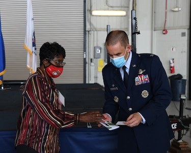 U.S. Air Force Col. Marc Greene, 628th Air Base Wing commander, familiarizes himself with civic leaders during the Honorary Commander Induction Ceremony, Sept. 17, 2020 at Joint base Charleston. Civic and base leaders came together for a brief socially-distanced event that introduced new honorary commanders to their respective Joint Base Charleston counterparts. The Honorary Commander’s Program provides leaders within the community an opportunity to learn more about the base’s mission including all tenant units. The program also allows service members to become more connected to their local community.