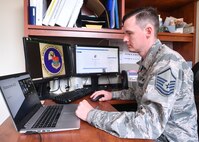 Master Sgt. Brandon McCarty, Airman Leadership School commandant, participates in a virtual graduation ceremony for ALS class 20G held on Zoom