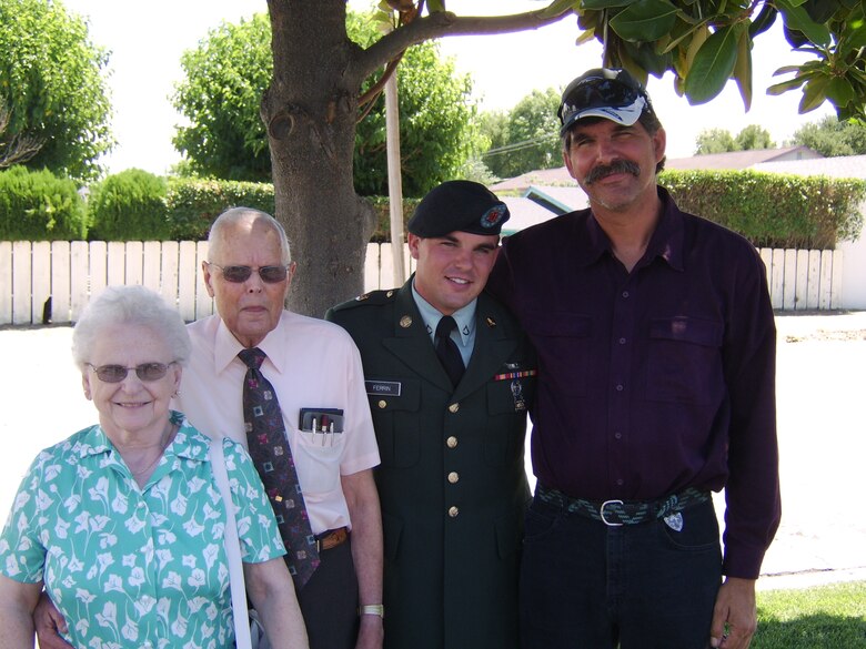 Corrie Ferrin, a private first class in the U.S. Army at the time of this photo, poses for a picture with his adopted grandparents and his father, Oct. 20, 2005, at Paso Robles, California, after returning from a deployment to Iraq. Ferrin’s grandparents played an instrumental role in his upbringing after his mother left him at infancy and his father was busy supporting what was left of his family. (Courtesy photo)