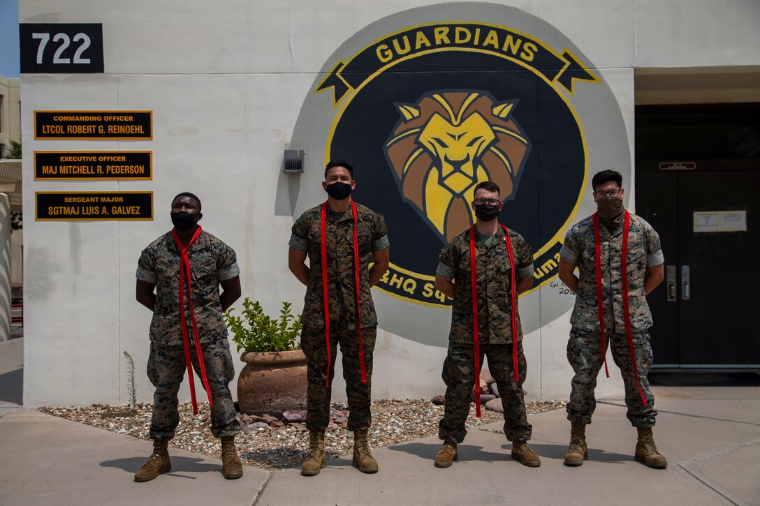 U.S. Marines assigned to Marine Corps Air Station (MCAS) Yuma, Headquarters and Headquarters Squadron (H&HS), receive their blood stripe during the H&HS Blood Stripe Ceremony at MCAS Yuma, Ariz., August 3, 2020.