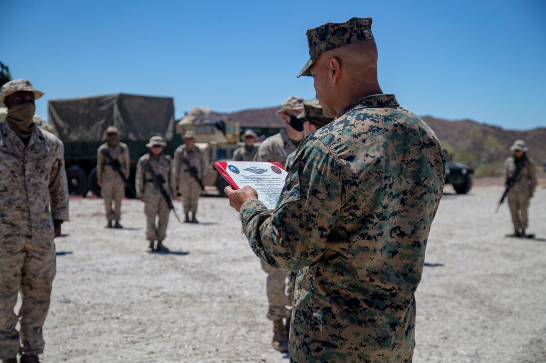 U.S. Navy Hospital Corpsmen (HM) 3 Ayite Akypokli and HM2 Courtland Morris, field medical service technicians, attached to Marine Air Control (MACS) 1 receive their Enlisted Fleet Marine Force (FMF) Warfare Specialist Insignia award at Yuma Proving Grounds (YPG) aboard Marine Corps Air Station Yuma, Aug. 6, 2020.