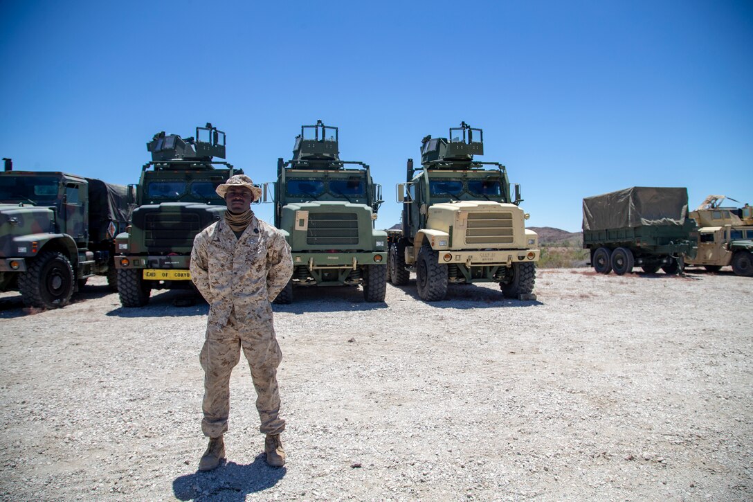 U.S. Navy Hospital Corpsmen (HM) 3 Ayite Akypokli and HM2 Courtland Morris, field medical service technicians, attached to Marine Air Control (MACS) 1 receive their Enlisted Fleet Marine Force (FMF) Warfare Specialist Insignia award at Yuma Proving Grounds (YPG) aboard Marine Corps Air Station Yuma, Aug. 6, 2020.