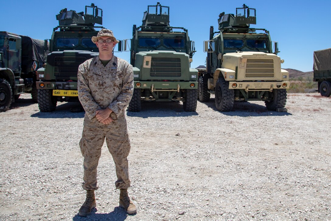 U.S. Navy Hospital Corpsmen (HM) 3 Ayite Akypokli and HM2 Courtland Morris, field medical service technicians, attached to Marine Air Control (MACS) 1 receive their Enlisted Fleet Marine Force (FMF) Warfare Specialist Insignia award at Yuma Proving Grounds (YPG) aboard Marine Corps Air Station Yuma, Aug. 6, 2020.