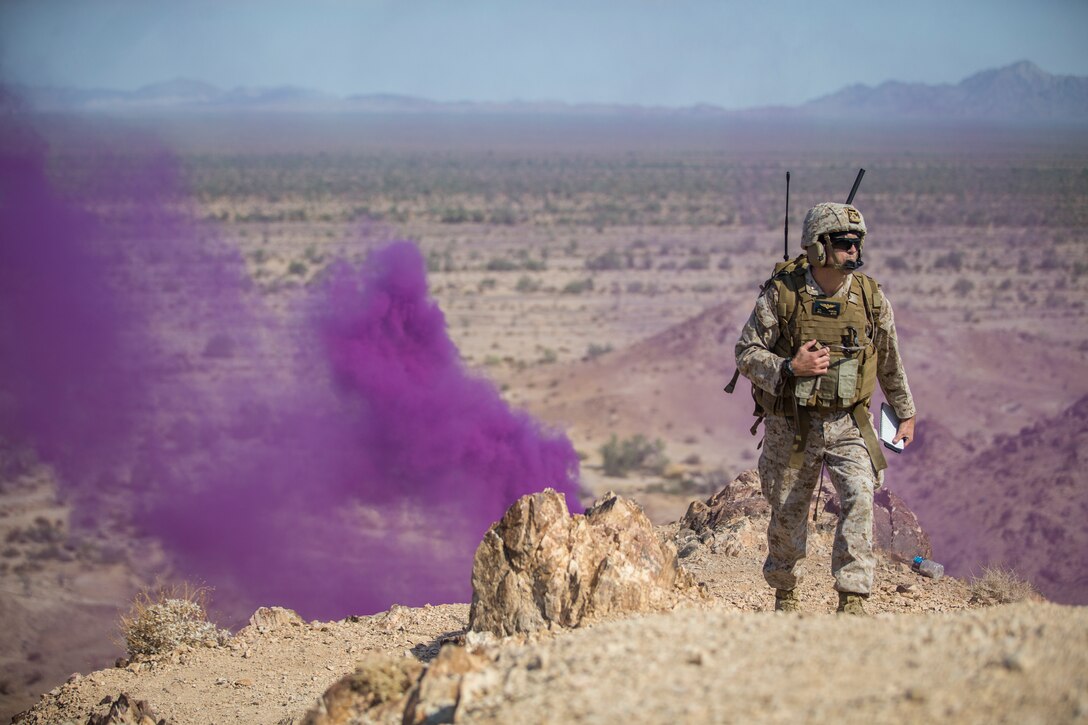 U.S. Marine Corps Maj. Eric Nilsson, an air officer with Marine Aviation Weapons and Tactics Squadron (MAWTS) 1 oversees a live ordnance observation training as the Range Safety Officer in Yuma, Ariz., Aug. 28, 2020. The training was conducted with Marine Operational Test and Evaluation Squadron (VMX) 1 to allow Marines the opportunity to observe live fire and ordnance while out in the field. (U.S. Marine Corps photo by Lance Cpl. John Hall)