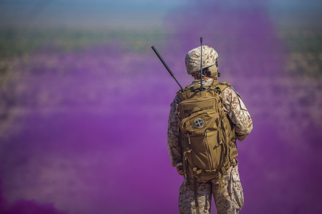 U.S. Marine Corps Maj. Eric Nilsson, an air officer with Marine Aviation Weapons and Tactics Squadron (MAWTS) 1 oversees a live ordnance observation training as the Range Safety Officer in Yuma, Ariz., Aug. 28, 2020. The training was conducted with Marine Operational Test and Evaluation Squadron (VMX) 1 to allow Marines the opportunity to observe live fire and ordnance while out in the field. (U.S. Marine Corps photo by Lance Cpl. John Hall)