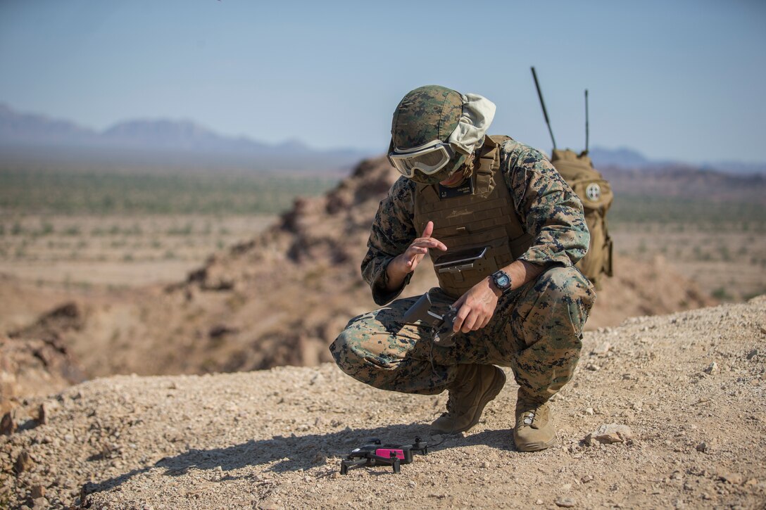 U.S. Marine Corps Sgt. Freddy Calderon, an unmanned aerial vehicle (UAV) operator with  Marine Operational Test and Evaluation Squadron (VMX) 1, operates a small UAV during a live ordnance observation training in Yuma, Ariz., Aug. 28, 2020.