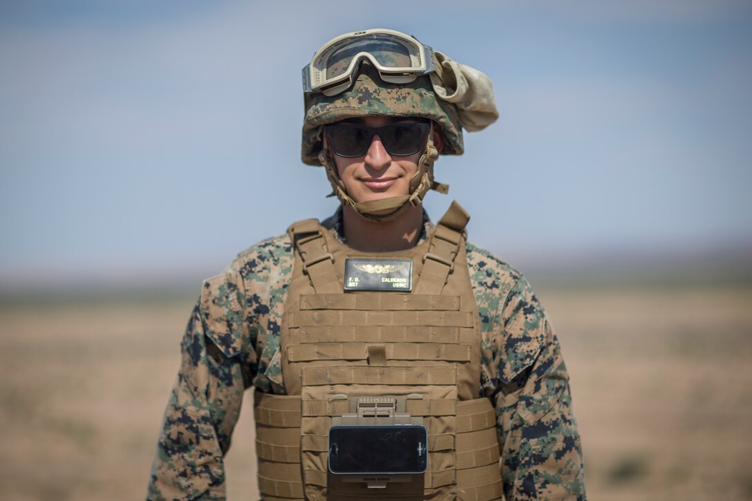 U.S. Marine Corps Sgt. Freddy Calderon, an unmanned aerial vehicle (UAV) operator with  Marine Operational Test and Evaluation Squadron (VMX) 1, operates a small UAV during a live ordnance observation training in Yuma, Ariz., Aug. 28, 2020.