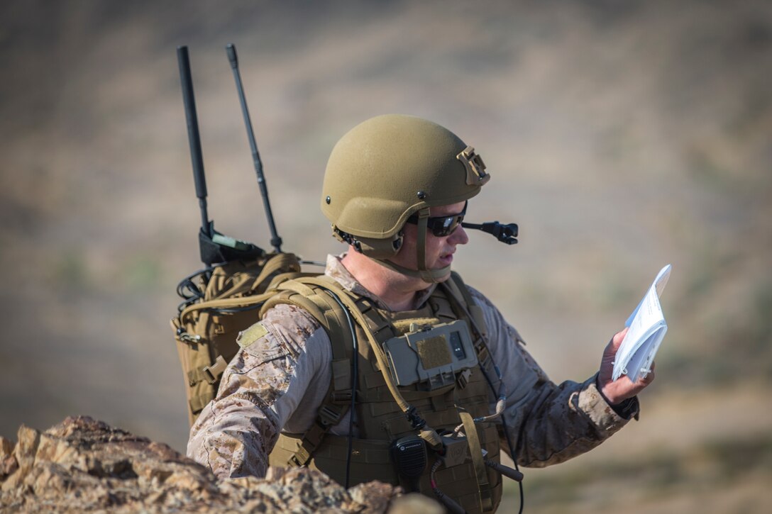 U.S. Marines with Marine Aviation Weapons and Tactics Squadron (MAWTS) 1 hike to an observation point during a live ordnance observation training in Yuma, Ariz., Aug. 28, 2020.