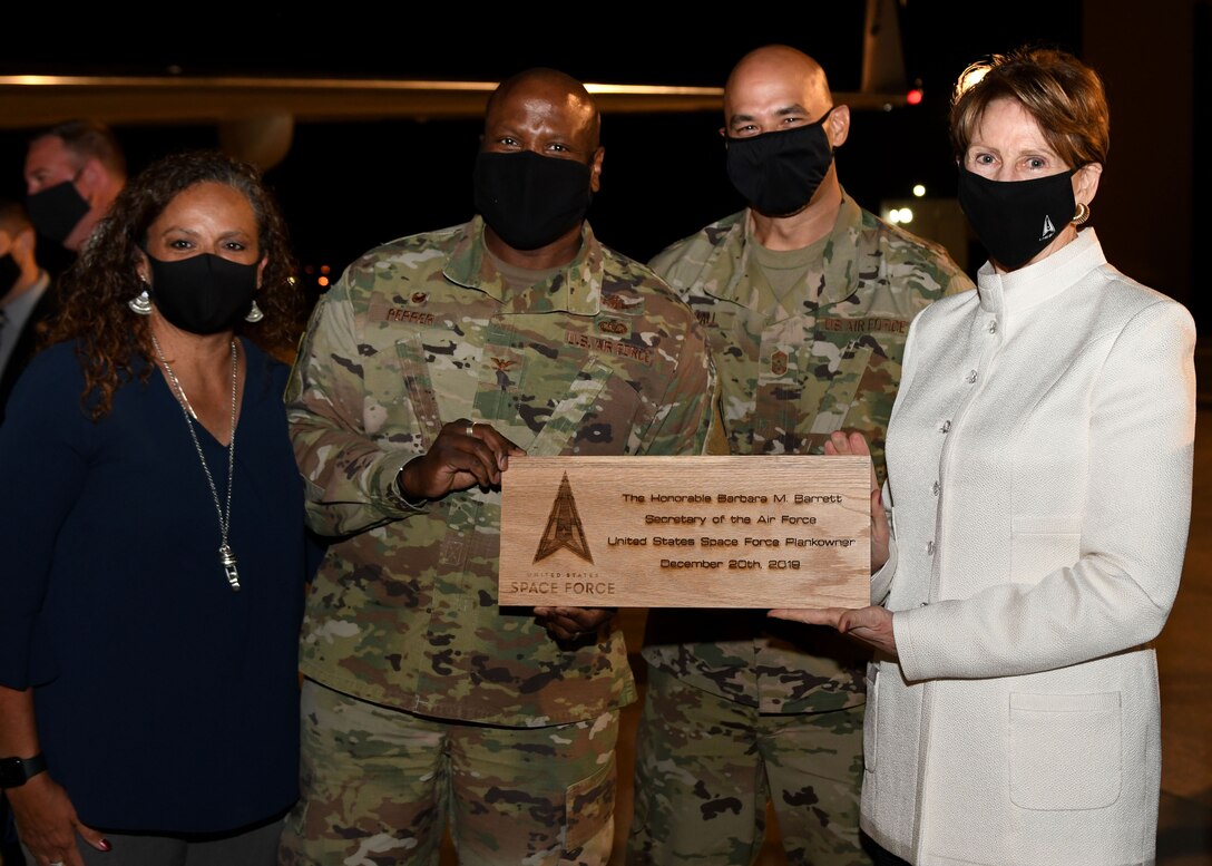 Secretary of the Air Force Barbara Barrett is presented with a plaque from Buckley Garrison command team prior to her departure from Buckley Air Force Base, Colo., on Sept. 23, 2020.