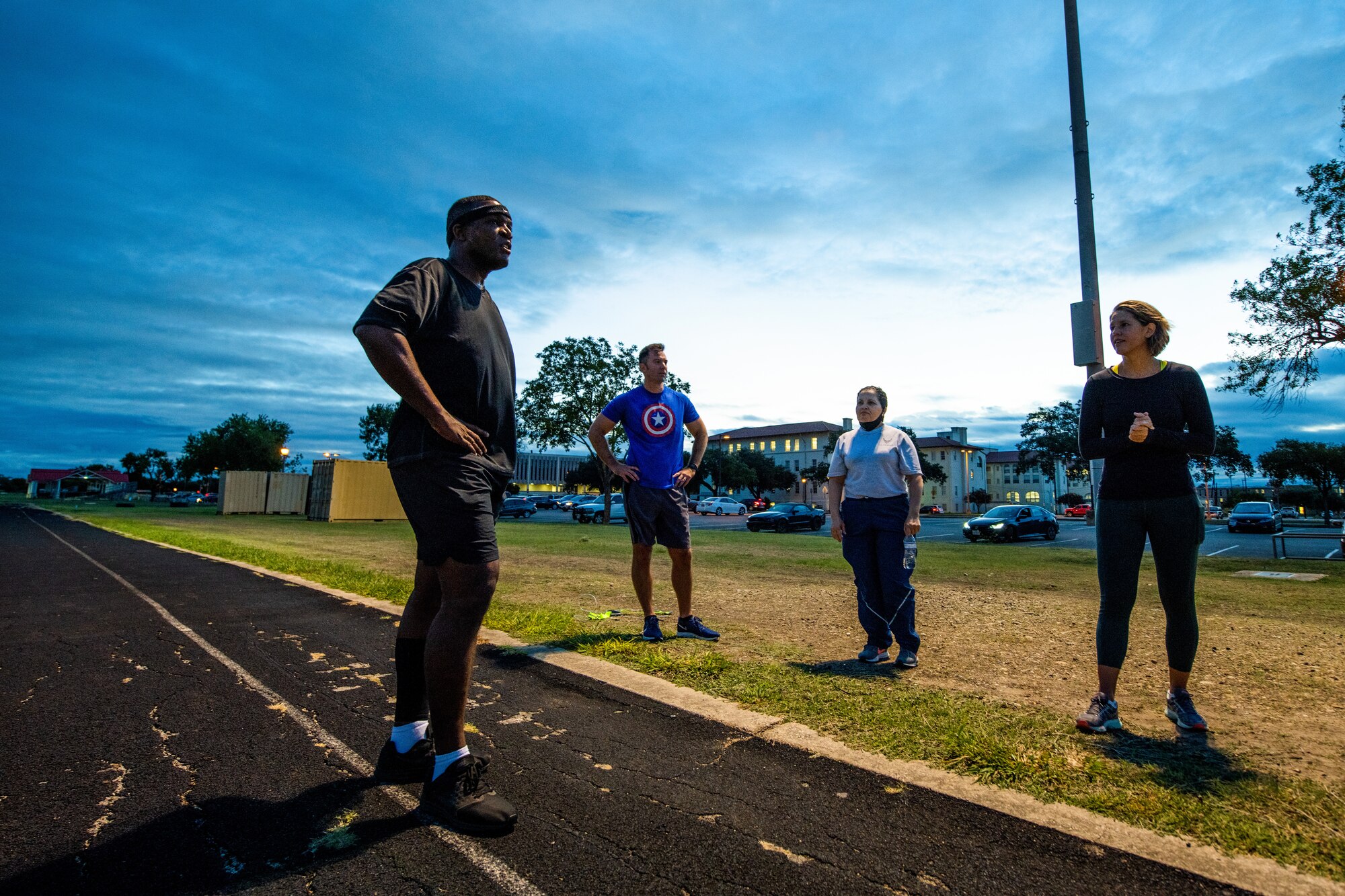 U.S. Air Force Chief Master Sgt. Wendell Snider (left), 502nd Air Base Wing and Joint Base San Antonio command chief, meets with participants for a three-mile run Sept. 22, 2020, at JBSA-Fort Sam Houston, Texas.