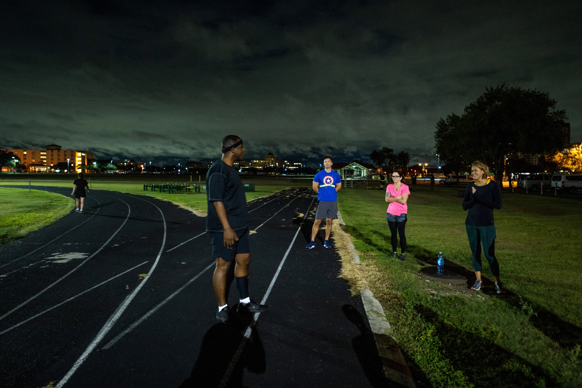 U.S. Air Force Chief Master Sgt. Wendell Snider, left, 502nd Air Base Wing and Joint Base San Antonio command chief, meets with participants for a three-mile run Sept. 22, 2020, at JBSA-Fort Sam Houston, Texas. Snider, along with JBSA teammates, used exercise to connect and decompress.