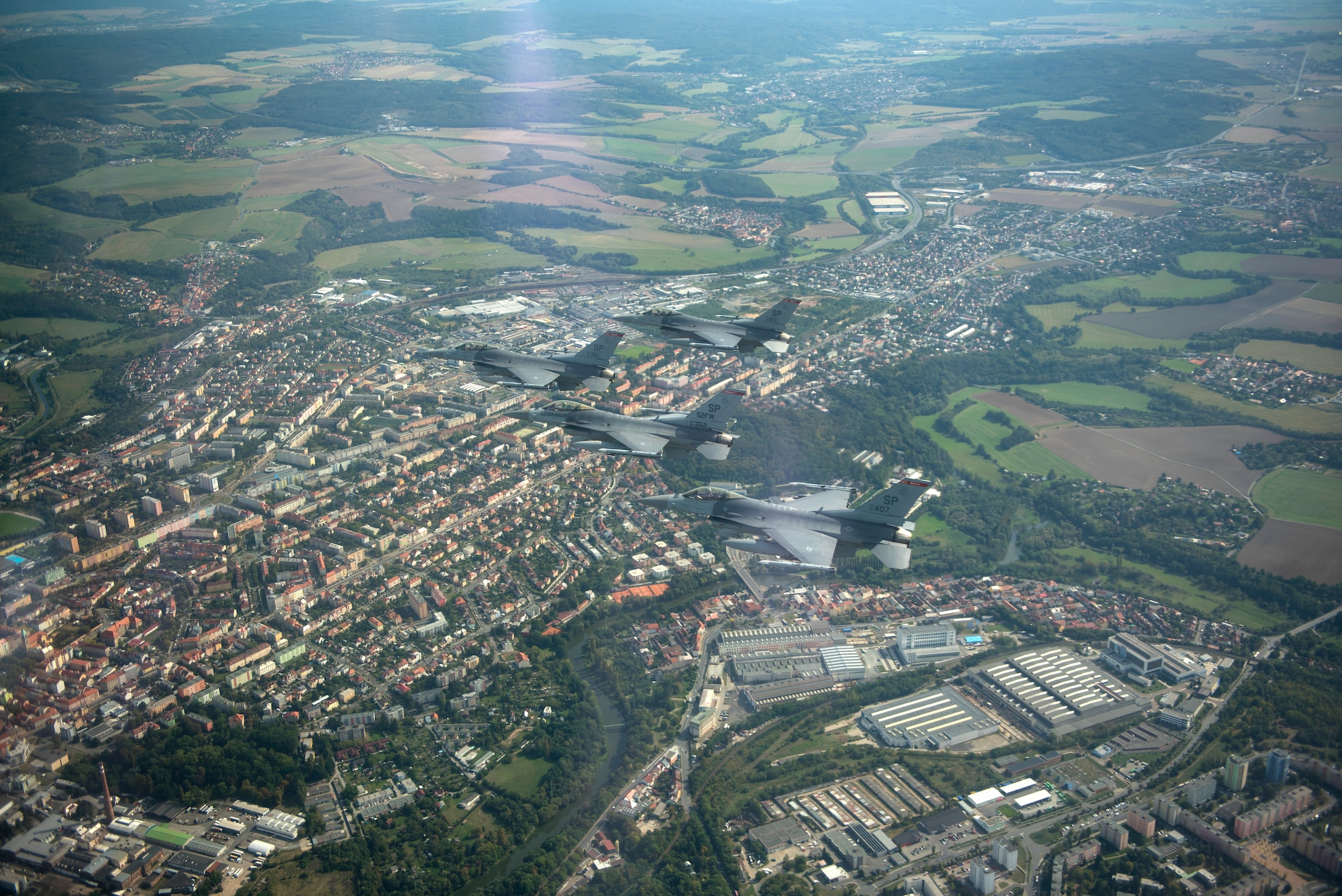 Four U.S. Air Force F-16 Fighting Falcons assigned to the 52nd Fighter Wing fly over the "Thank You America Memorial" at Pilsen, Czechia, Sept. 19, 2020. The memorial was erected in honor of the U.S. forces that liberated Pilsen in May 1945. (U.S. Air Force photo by Senior Airman Chanceler Nardone)