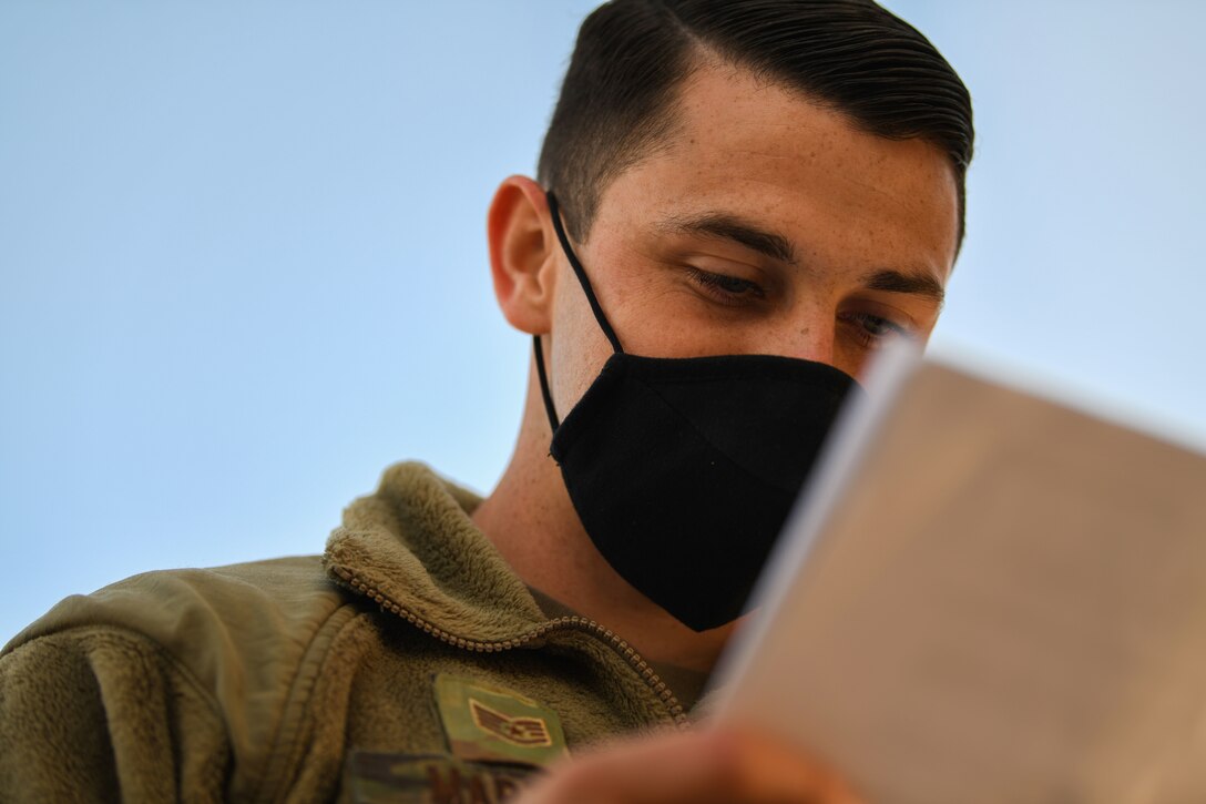 U.S. Air Force Staff Sgt. Travis Martinez, 31st Aircraft Maintenance Squadron dedicated crew chief, reads the technical data of the TowFLEXX during exercise Thracian Viper 20, Sept. 24, 2020, at Graf Ignatievo Air Base, Bulgaria. A TowFLEXX is a remote-controlled system designed to tow an aircraft. Towing an aircraft usually takes at least three Airmen; however, with the TowFLEXX, it only requires two Airmen, and reduces the amount of time it takes to tow an aircraft. (U.S. Air Force photo by Airman 1st Class Ericka A. Woolever)