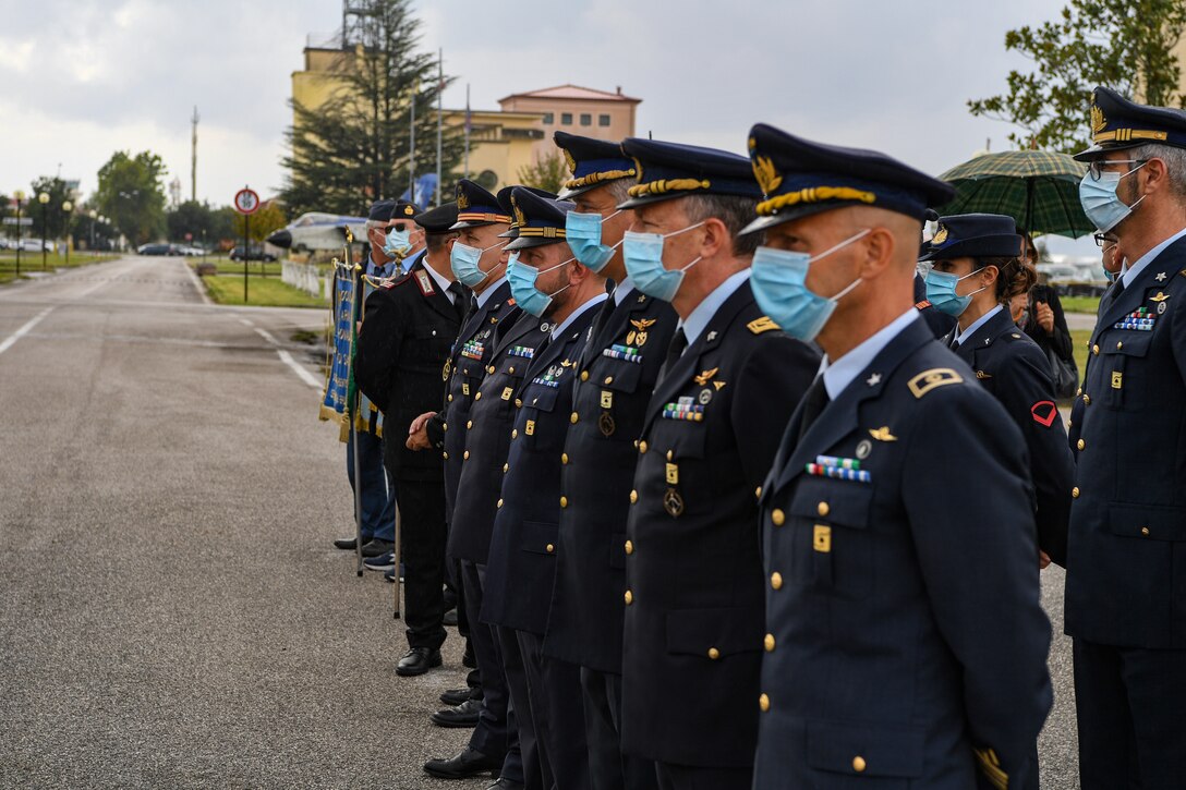 Italian air force members await the arrival of the “Madonna di Loreto” statue at Aviano Air Base, Italy, Sept. 23, 2020. The holy statue is visiting all Italian air force departments for the Lauretan Jubilee in celebration of the centenary of the proclamation of the Blessed Virgin of Loreto, as the Patroness of Aeronauts. The statue of the Virgin of Loreto, specially made for the Lauretan Jubilee is represented by a preciously-dressed statue contained in an oak case. (U.S. Air Force photo by Airman 1st Class Thomas S. Keisler IV)
