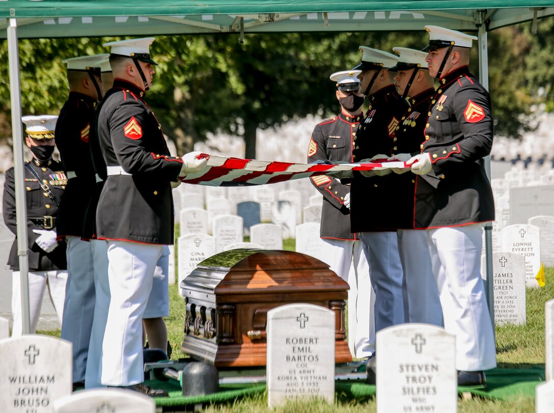 Marine Corps Body Bearers, Bravo Company, Marine Barracks Washington, D.C., prepare to fold the National Ensign during a full honors funeral for repatriated WWII Marine Pfc. Harry Morrissey at Arlington National Cemetery, Arlington, Virginia, Sept. 22, 2020.