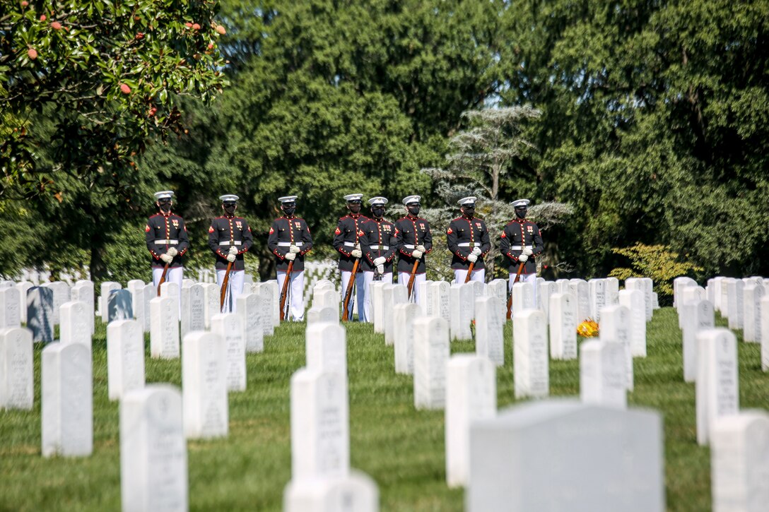 Marines with a Bravo Company firing party, Marine Barracks Washington, D.C., stand at “ceremonial at ease” during a full honors funeral for repatriated WWII Marine Pfc. Harry Morrissey at Arlington National Cemetery, Arlington, Virginia, Sept. 22, 2020. Morrissey, a Everett, Massachusetts native, was killed in action while participating in the main offensive of the Battle of Guadalcanal on October 9, 1942, while serving with Company B, 1st Battalion, 1st Marines, 1st Marine Division. His remains were found atop Hill 73 on August 28, 2017 and identified on December 17, 2017. (U.S. Marine Corps photo by Sgt. Robert Knapp/Released)