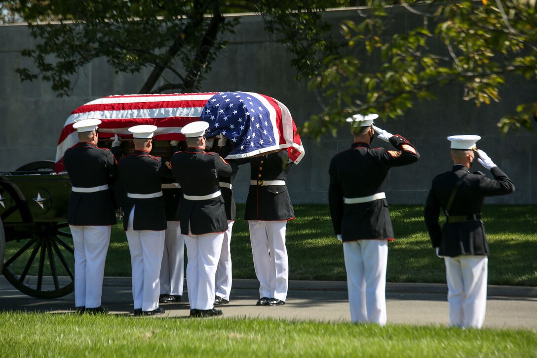Marine Corps Body Bearers, Bravo Company, Marine Barracks Washington, D.C., prepare to carry the casket of repatriated WWII Marine Pfc. Harry Morrissey to his final resting place during a full honors funeral for Morrissey at Arlington National Cemetery, Arlington, Virginia, Sept. 22, 2020.