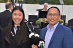 Marissa Yee and her father Kim Yee, Naval Surface Warfare Center, Philadelphia Division (NSWCPD) COR Supervisor, at the Flight 93 National Memorial Remembrance Ceremony in Shanksville, Pa., on September, 11, 2020. Marissa played the bagpipes during the ceremony and led the families on a procession to the crash site. (Photo courtesy Kim Yee, U.S. Navy/Released)