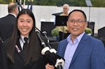 Marissa Yee and her father Kim Yee, Naval Surface Warfare Center, Philadelphia Division (NSWCPD) COR Supervisor, at the Flight 93 National Memorial Remembrance Ceremony in Shanksville, Pa., on September, 11, 2020. Marissa played the bagpipes during the ceremony and led the families on a procession to the crash site. (Photo courtesy Kim Yee, U.S. Navy/Released)