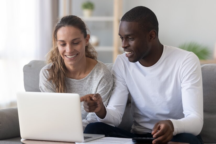 Couple looking at computer together