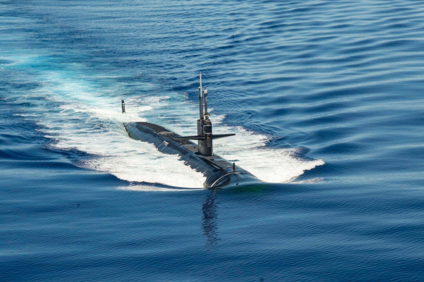 The Los Angeles-class submarine USS Chicago (SSN 721) steams in formation with the aircraft carrier USS Ronald Reagan (CVN 76), in support of Valiant Shield 2020.