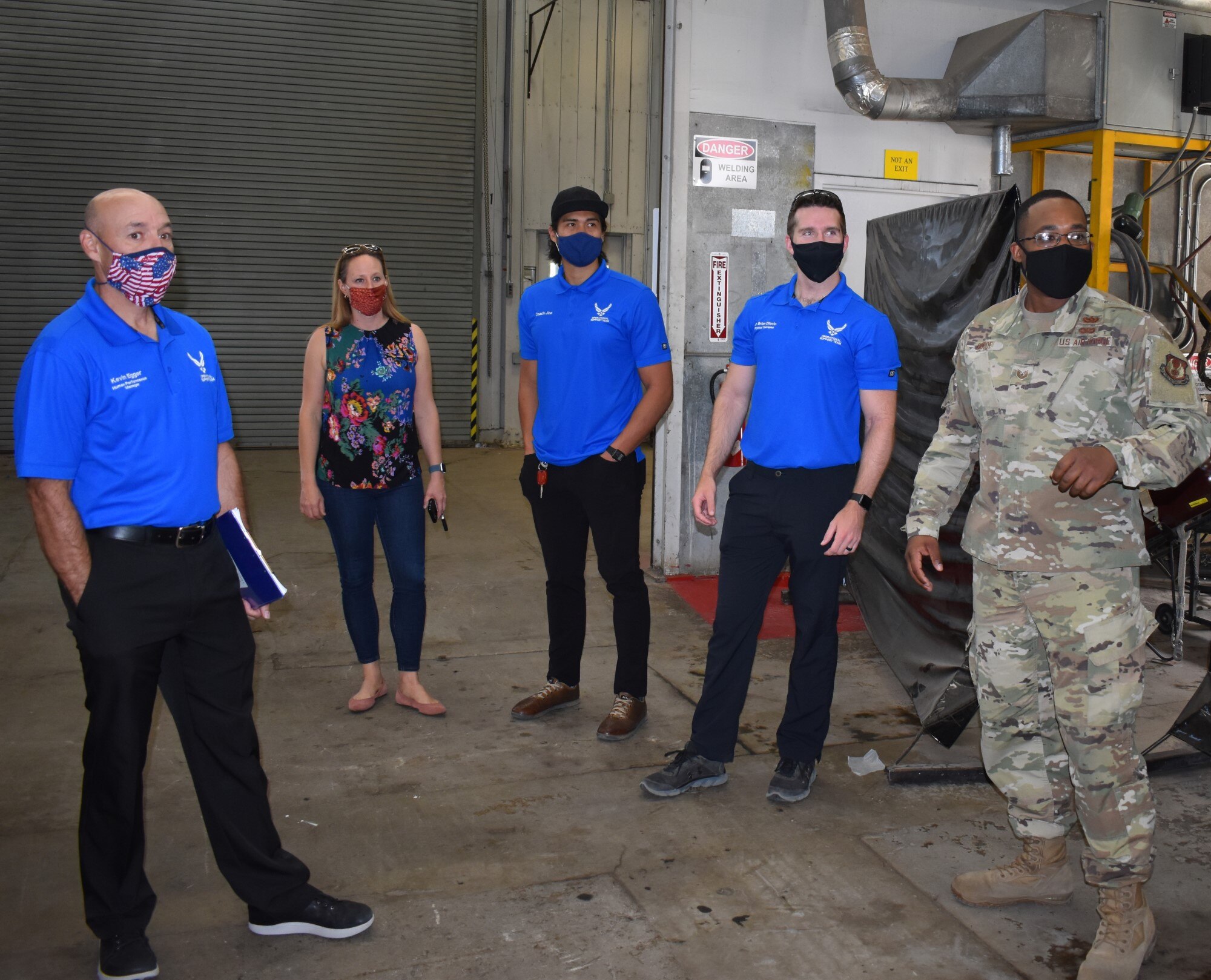 Tech. Sgt. Jamal Goode, 75th Logistics Readiness Squadron, gives a tour of Vehicle Maintenance to members of the Operational Support Team.