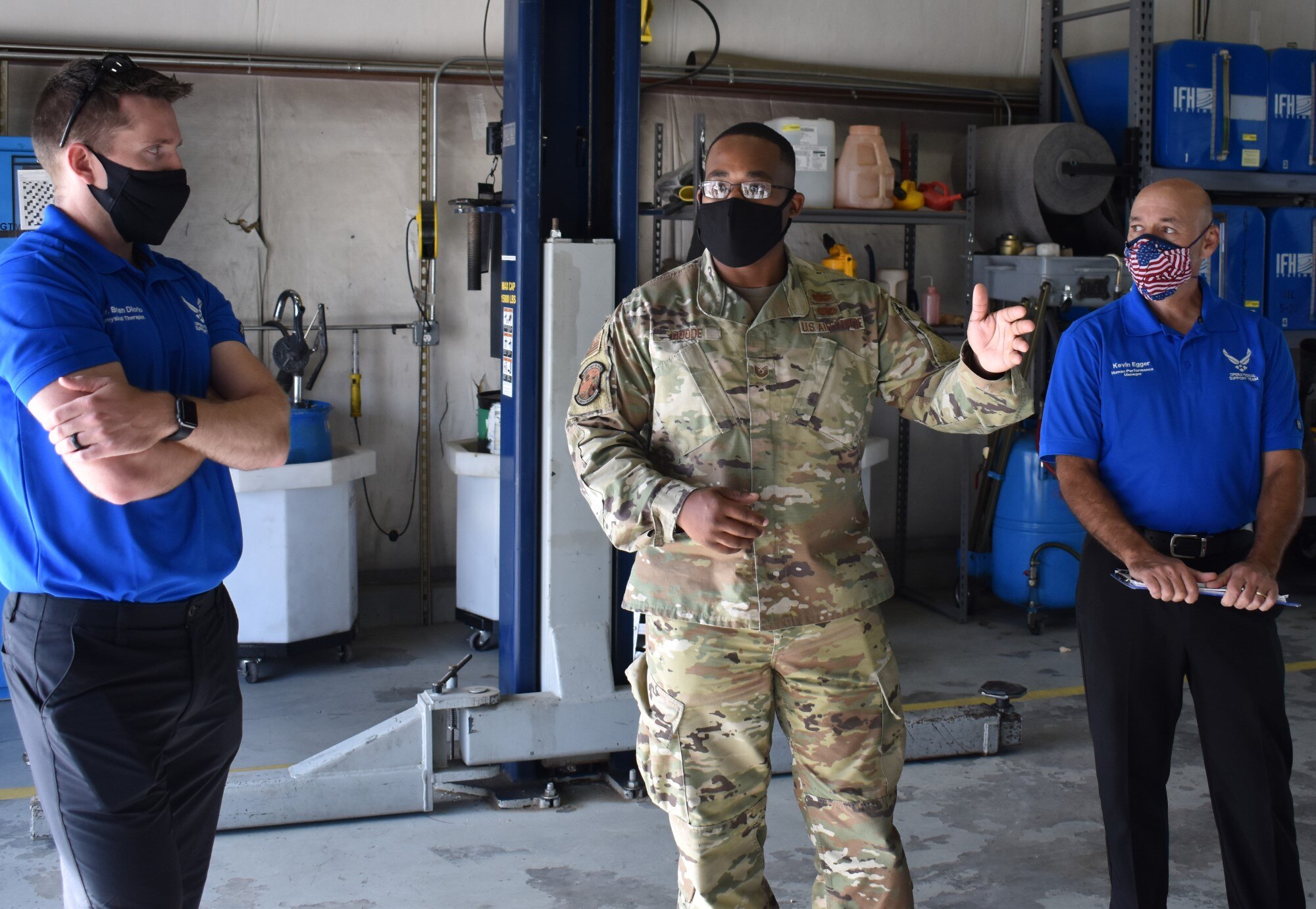 Tech. Sgt. Jamal Goode, 75th Logistics Readiness Squadron, gives a tour of Vehicle Maintenance, to members of the Operational Support Team, Kevin Egger (right) and Brian Diiorio.