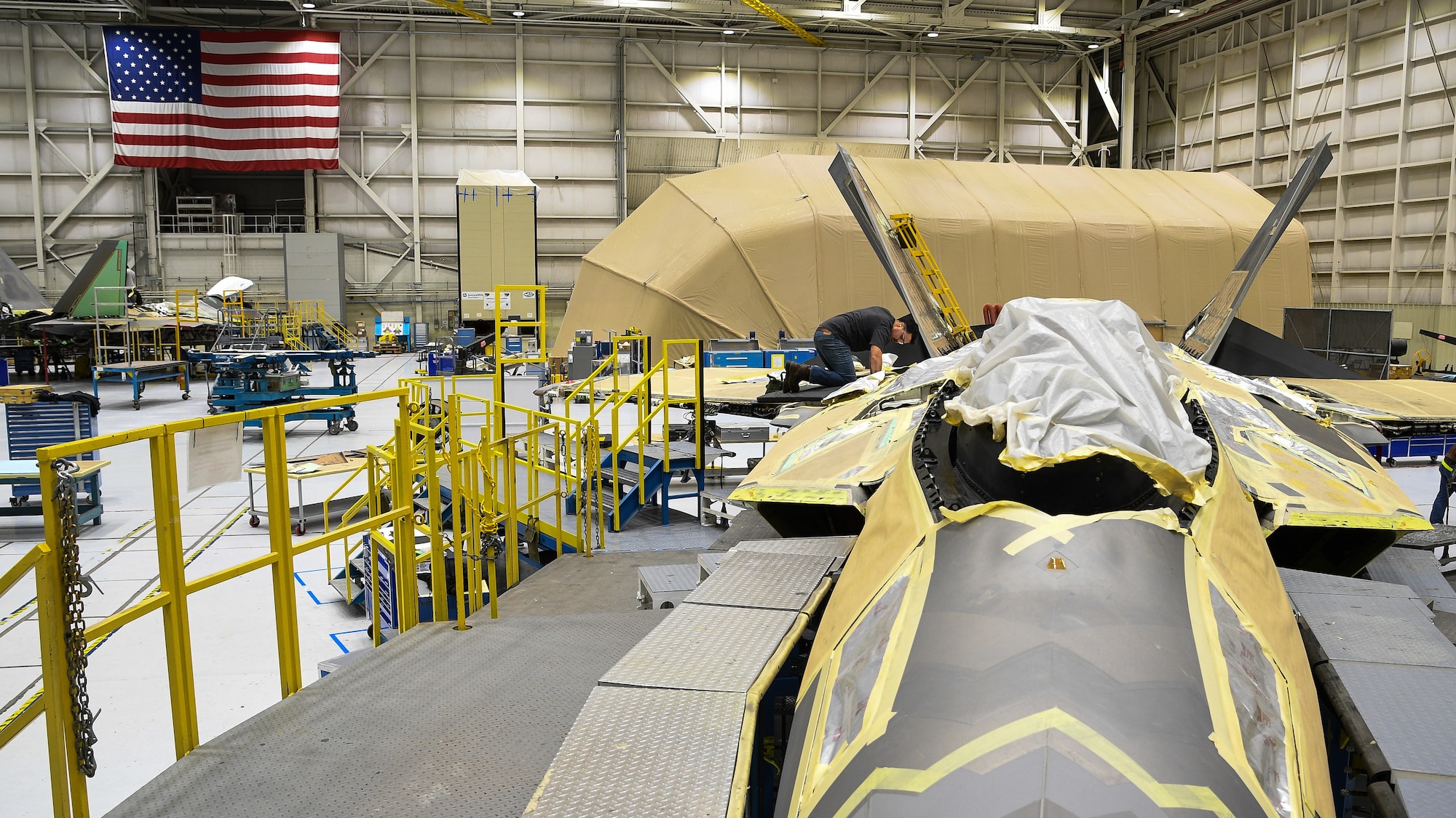 A 574th Aircraft Maintenance Sqaudron maintainer performs depot maintenance on F-22 fighter jet at Hill Air Force Base, Utah, Jan. 16, 2018. The 574th installed the first metallic 3D printed part on an operational F-22 in December. (U.S. Air Force photo by R. Nial Bradshaw)