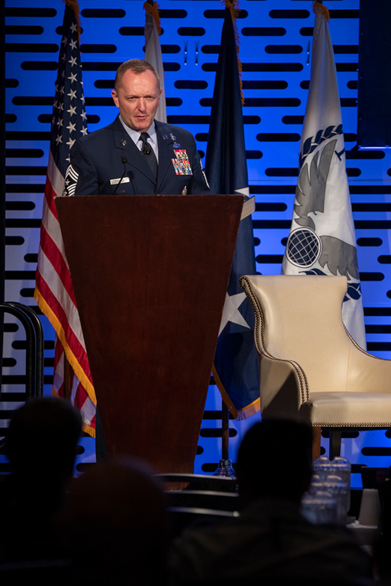 U.S. Air Force Chief Master Sgt. Jason France moderates the Senior Enlisted Leader roundtable at the National Defense Transportation Association-U.S. Transportation Command Fall Meeting 2019, Monday, Oct. 7, at St. Louis Union Station Hotel, Curio Collection by Hilton, St. Louis, Missouri. Similarly, he will facilitate the Virtual Fall Meeting 2020 SEL roundtable, “Innovations Achieved in Spite of Obstacles,” scheduled for Oct. 5 from 10:15-11:45 a.m. CDT. (Photo illustration by Stephenie Wade)